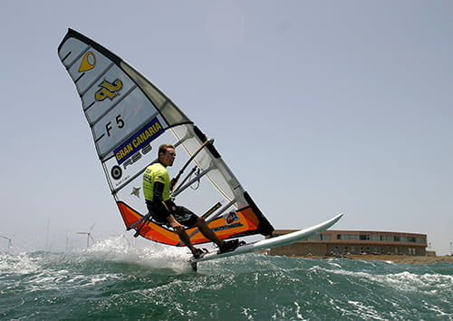 Young man practicing Windsurfing in Gran Canaria