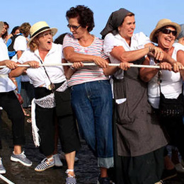 A group of neighbours playing and laughing in the festivities in Agüimes