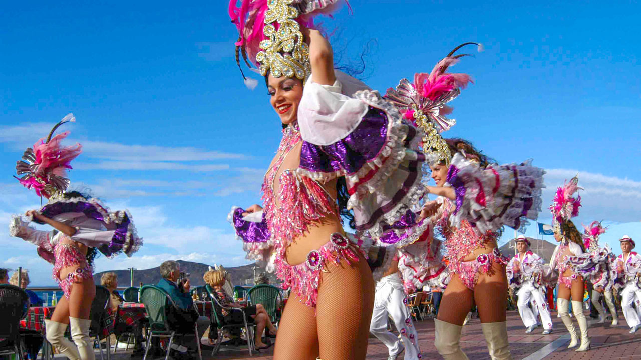 Carnival "comparsa" dancing troupe. Las Canteras Avenue