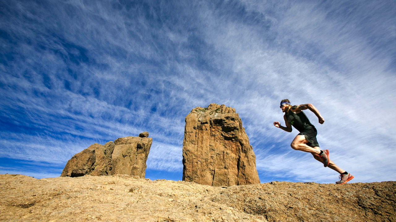 Timothy Olson next to the Roque Nublo in Gran Canaria