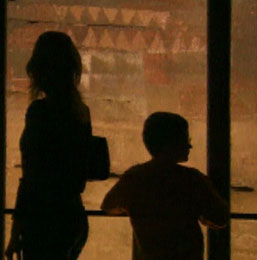 A family contemplating the paintings at the Cueva Pintada in Gáldar