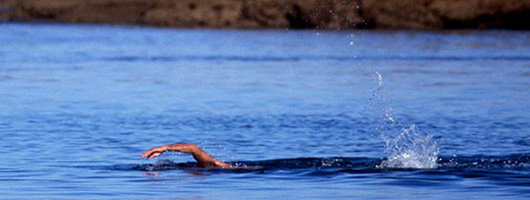 Swimming in the open sea at the beach of Las Canteras