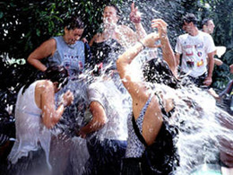 Kids playing with water in the festivity of Lomo Magullo