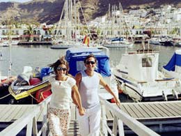 Couple strolling around Puerto de Mogán